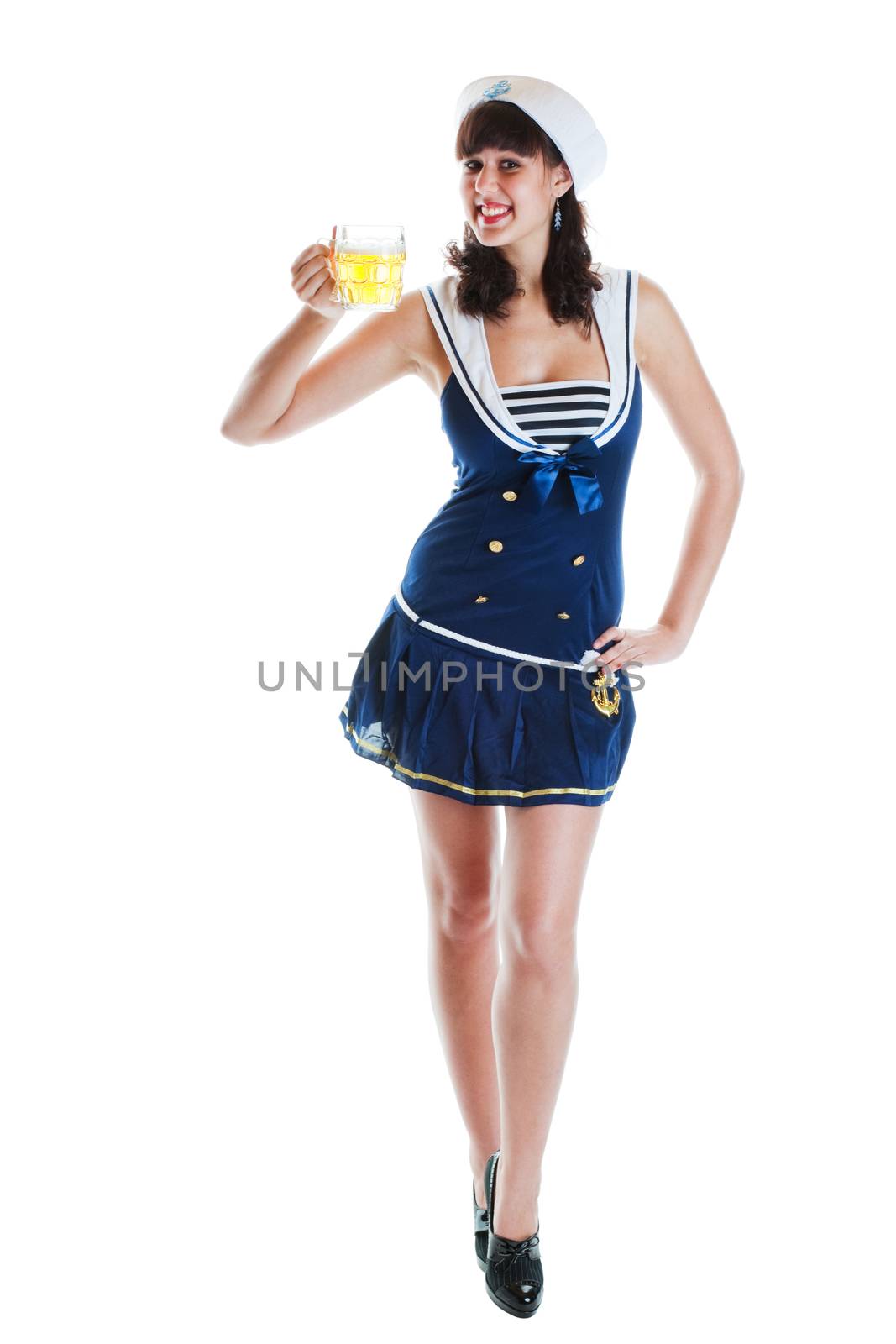 Pretty, young pinup girl in sailor suit holding a mug of beer.  Shot on white background.