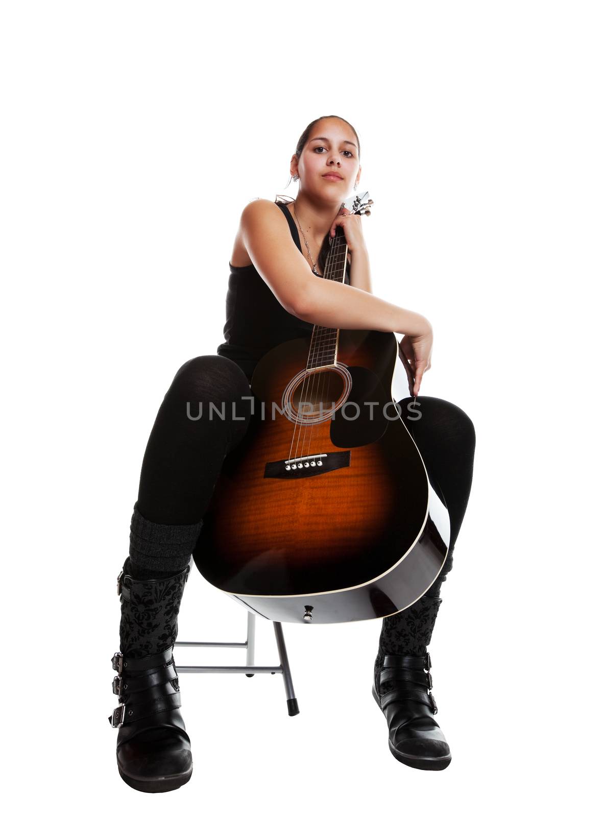 A young mixed-race girl with her acoustic guitar.  Shot on white background.