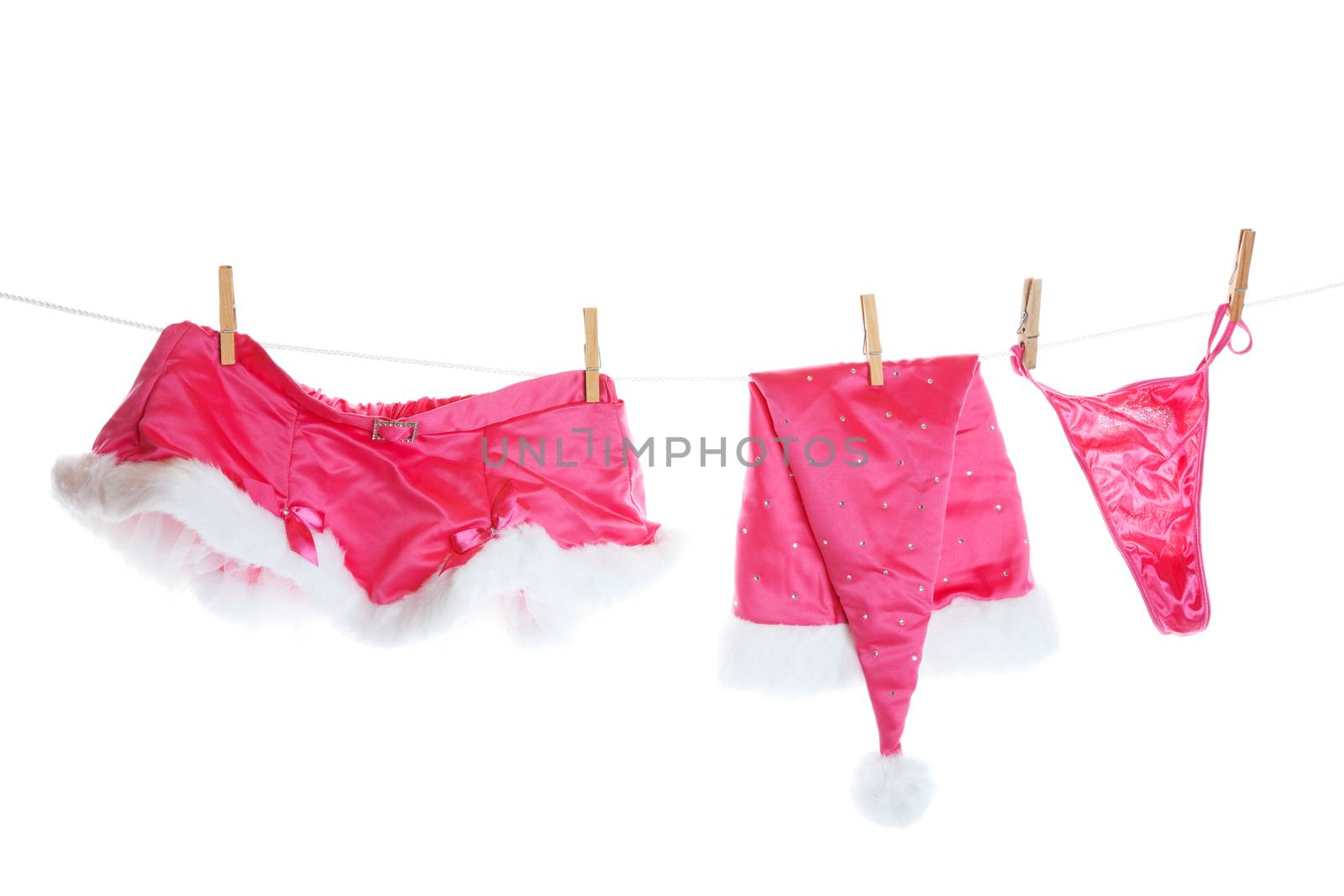 Sexy Santa's helper lingerie hanging on the line to dry.  Shot on white background.