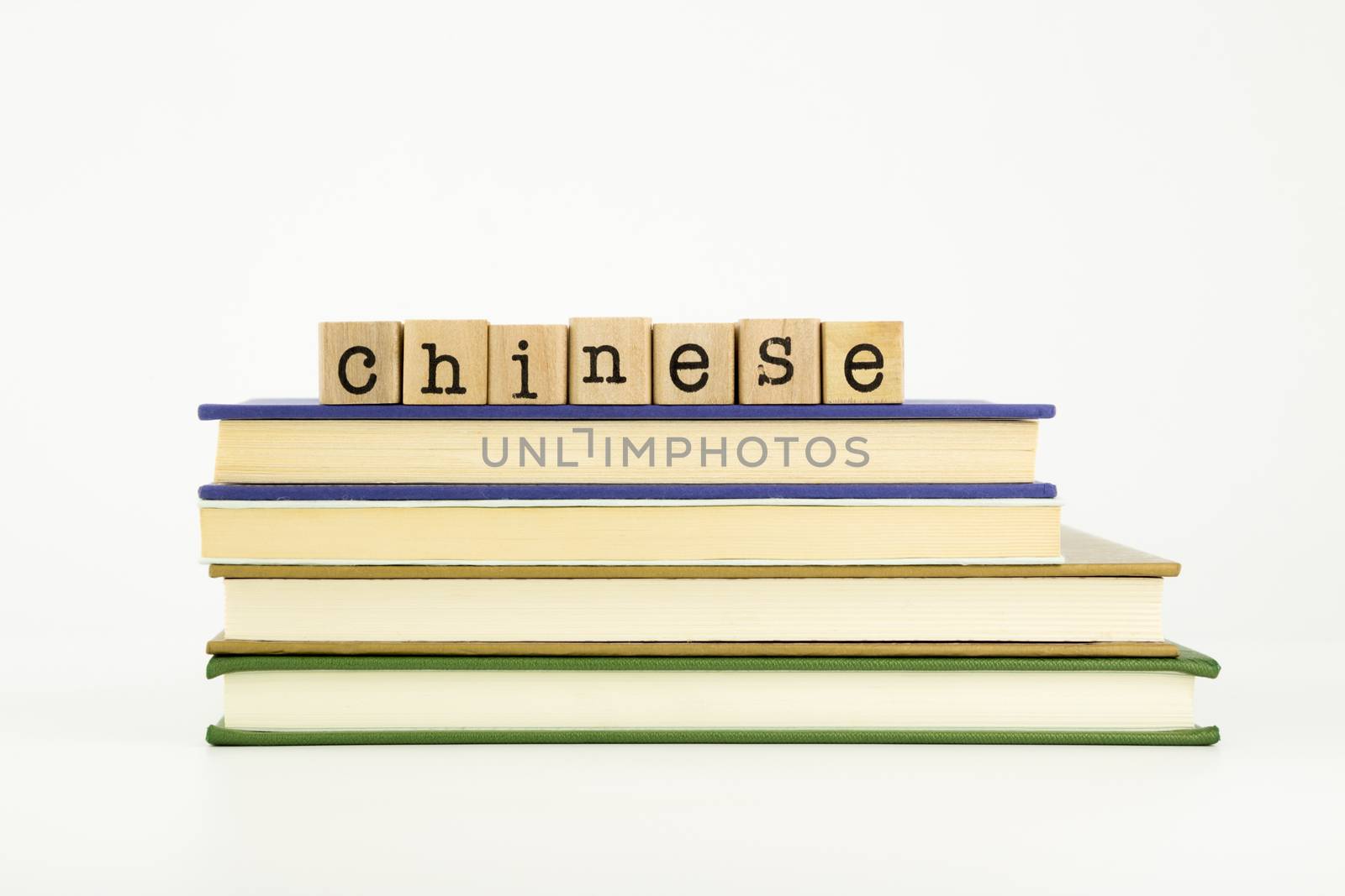 chinese word on wood stamps stack on books, language and academic concept