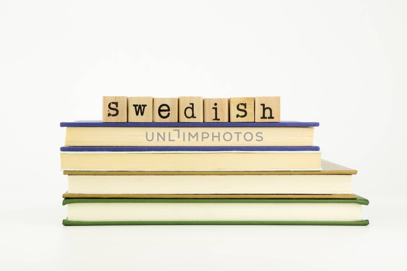 swedish language word on wood stamps and books by vinnstock