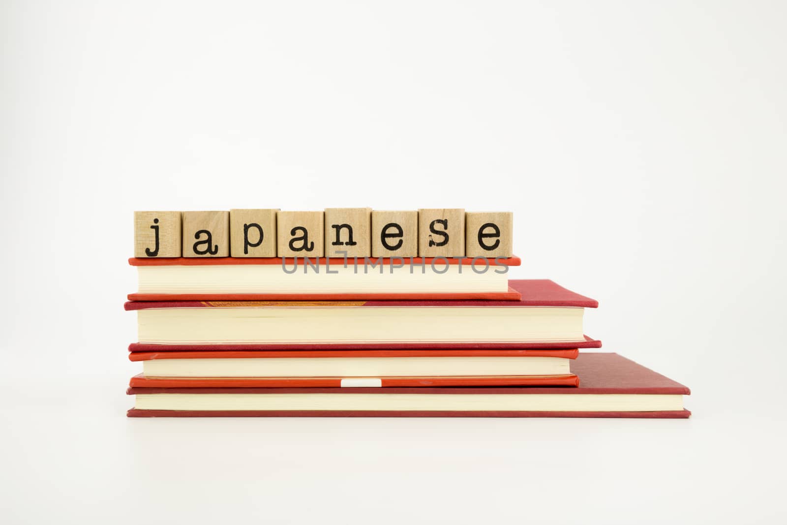 japanese language word on wood stamps and books by vinnstock
