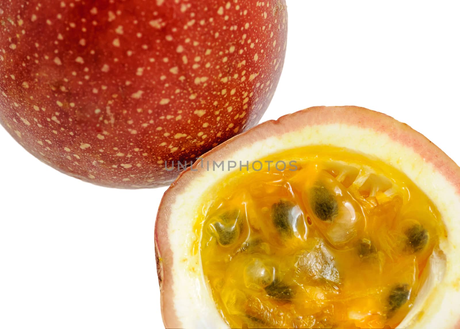 Passion fruit whole fruit and opened isolated on white background