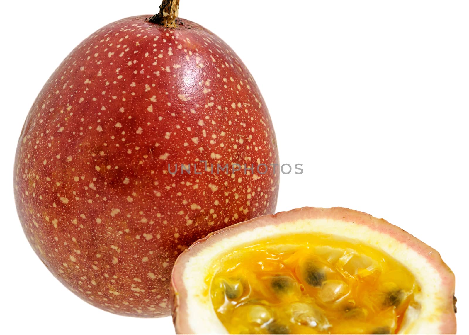 Passion fruit whole fruit and opened isolated on white background