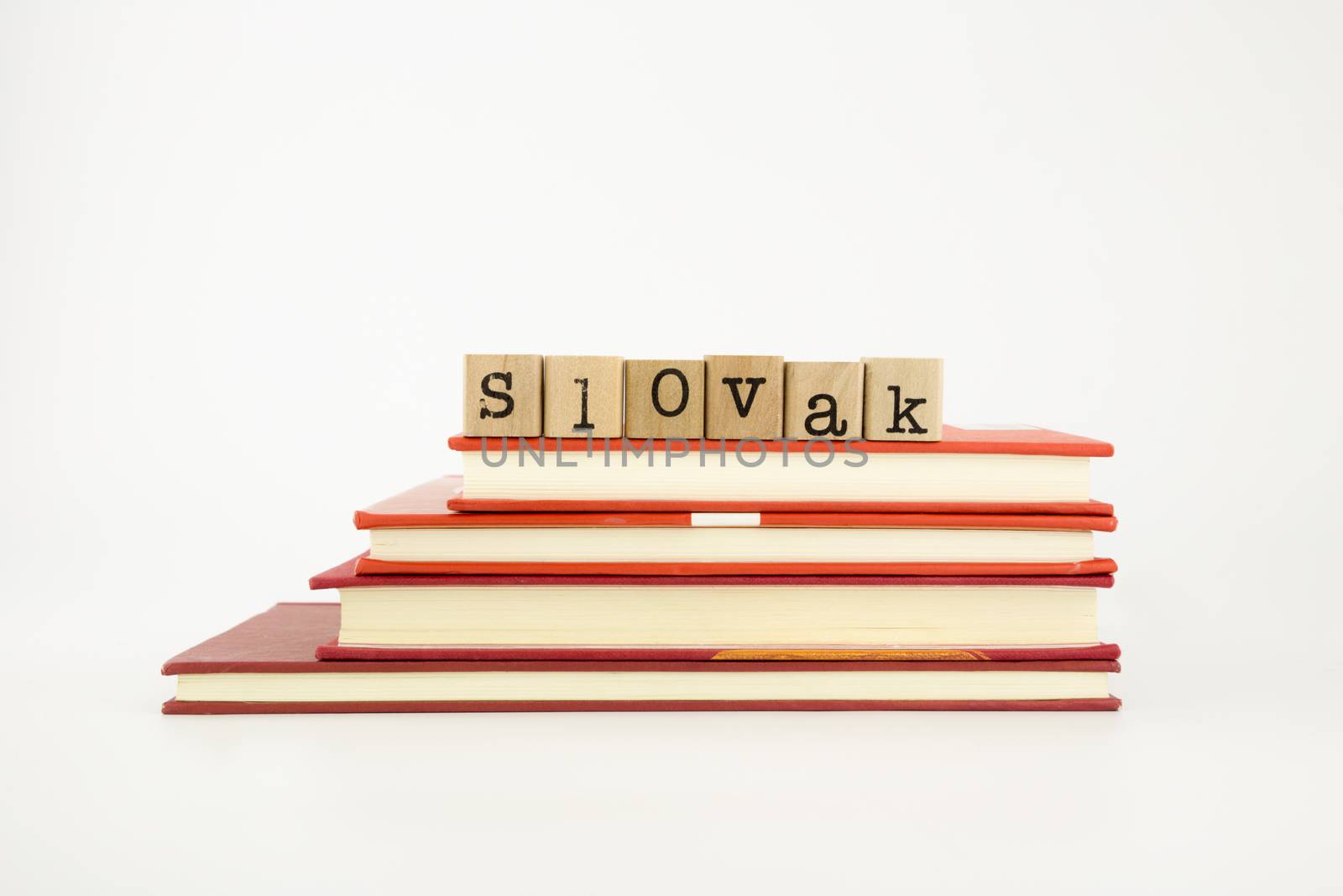 slovak word on wood stamps stack on books, language and academic concept