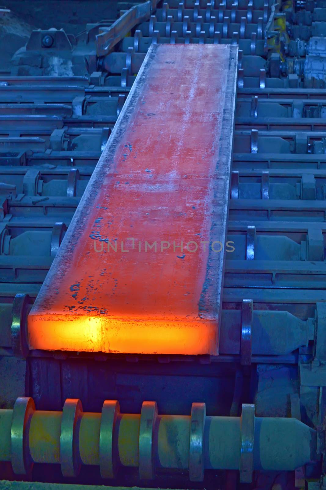 hot steel on conveyor inside of steel plant
