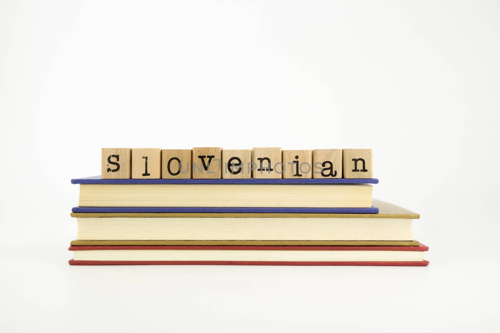 slovenian language word on wood stamps and books by vinnstock