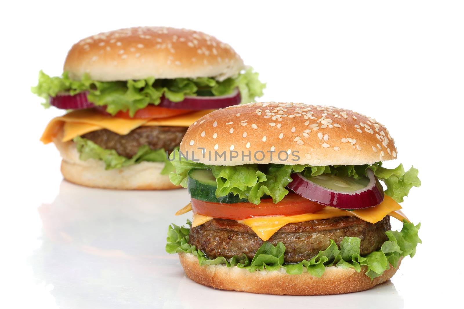 Two delicious hamburgers isolated on white background