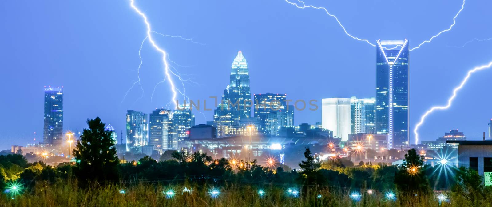 thunderstorm lightning strikes over charlotte city skyline in no by digidreamgrafix