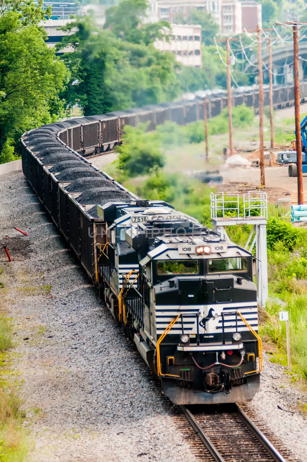 slow moving Coal wagons on railway tracks