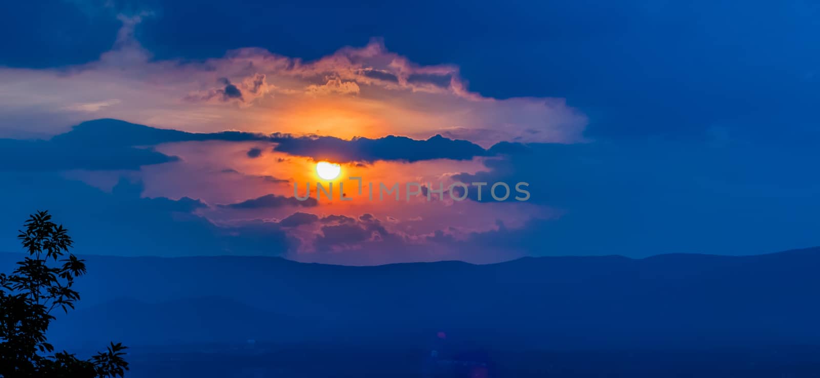 orange sunset sky and clouds over mountain valley by digidreamgrafix