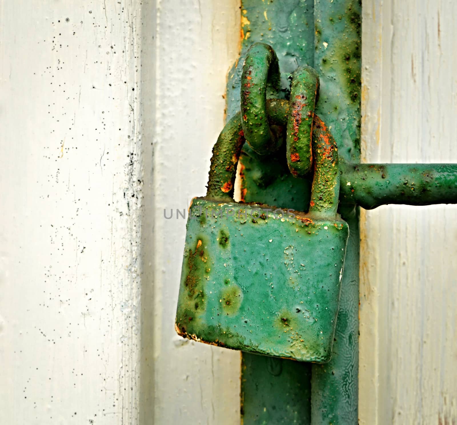 background with old green rusty iron padlock