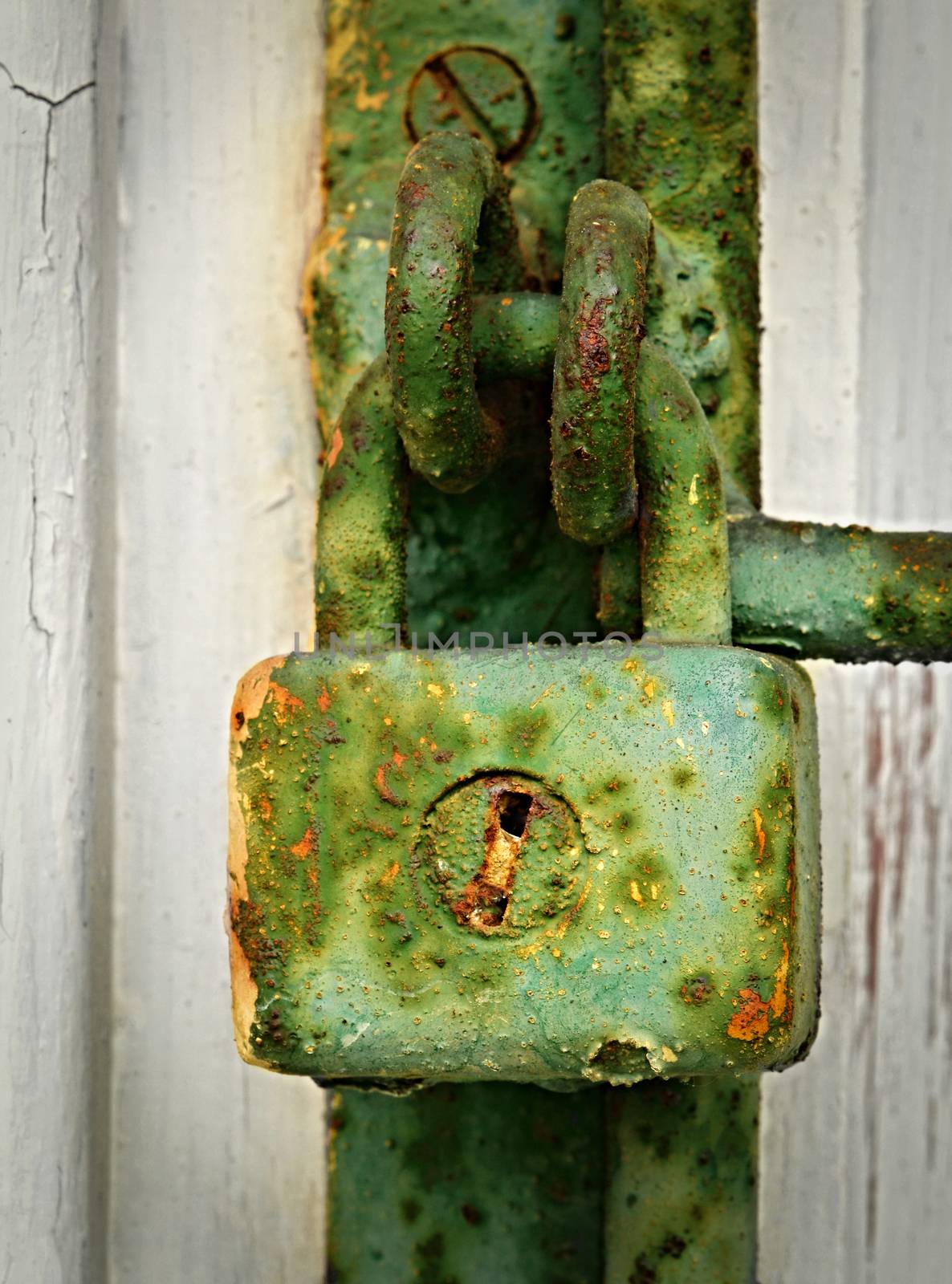 background with old green rusty iron padlock