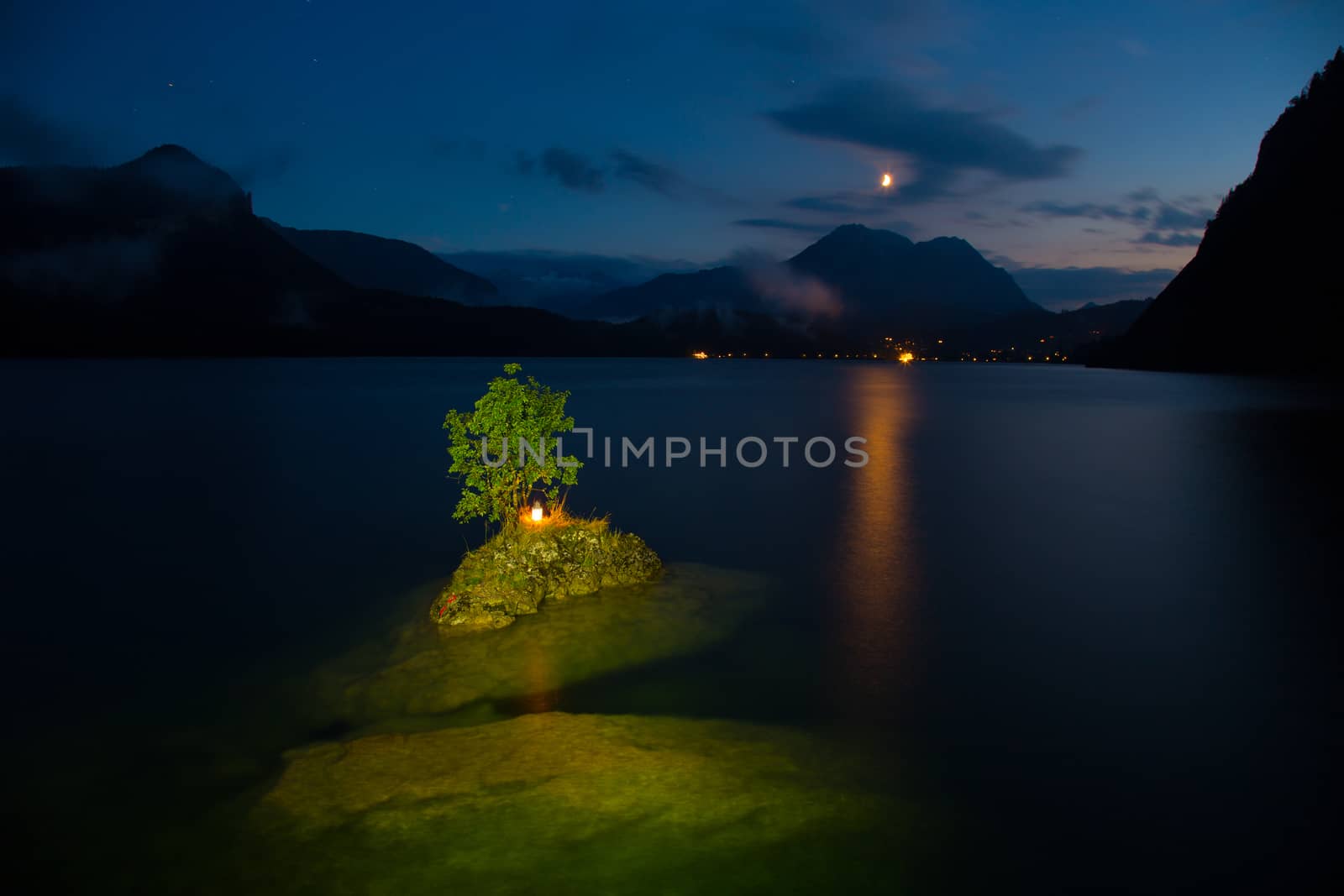 Small island on the lake in mountains Austria