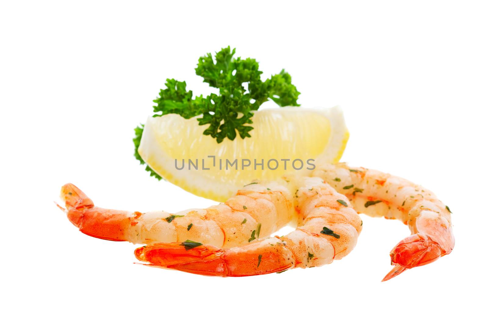Three delicious shrimp with a lemon wedge and parsley garnish.
