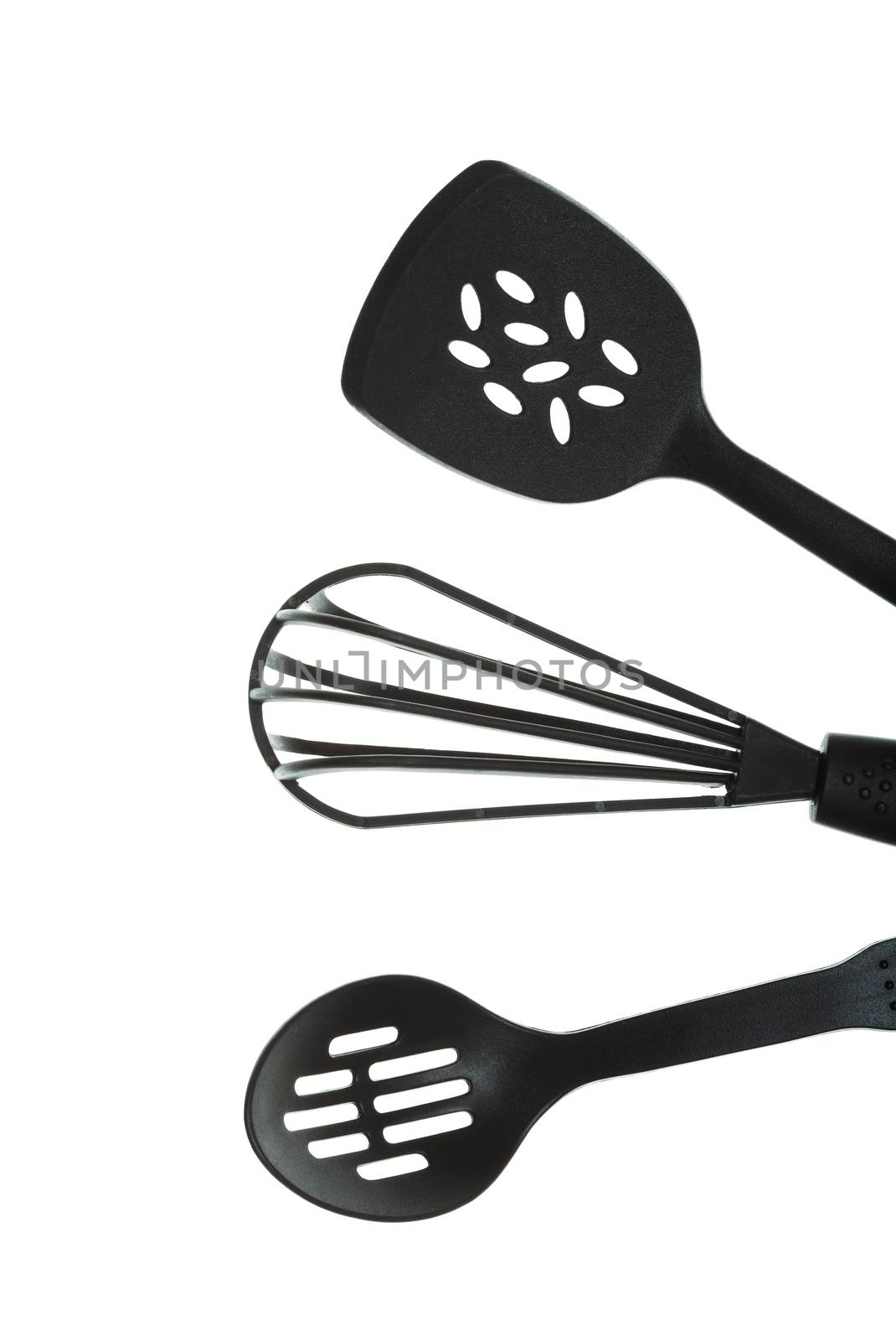 Black cooking utensils on a white background.