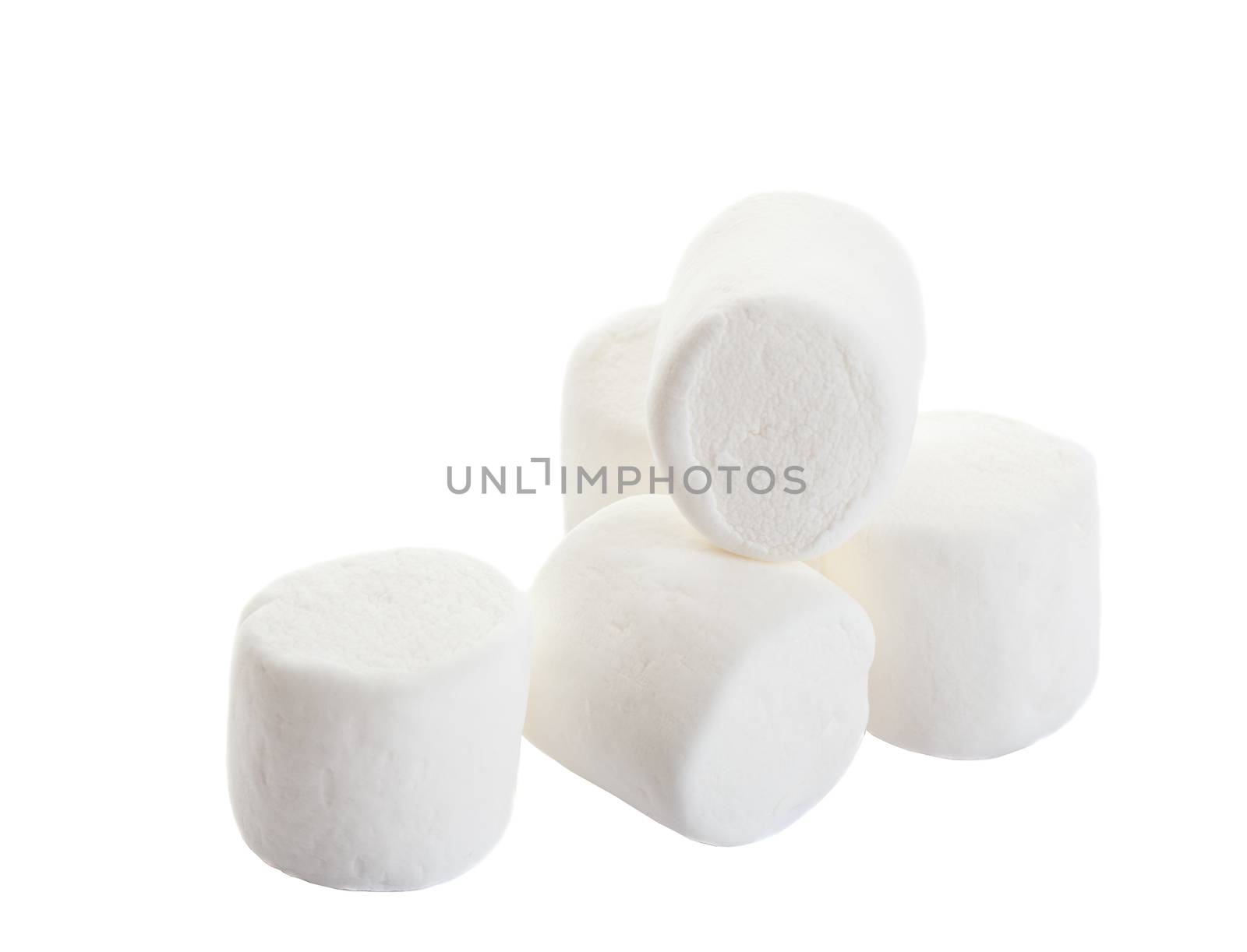 A pile of white puffy marshmallows.  Shot on white background.