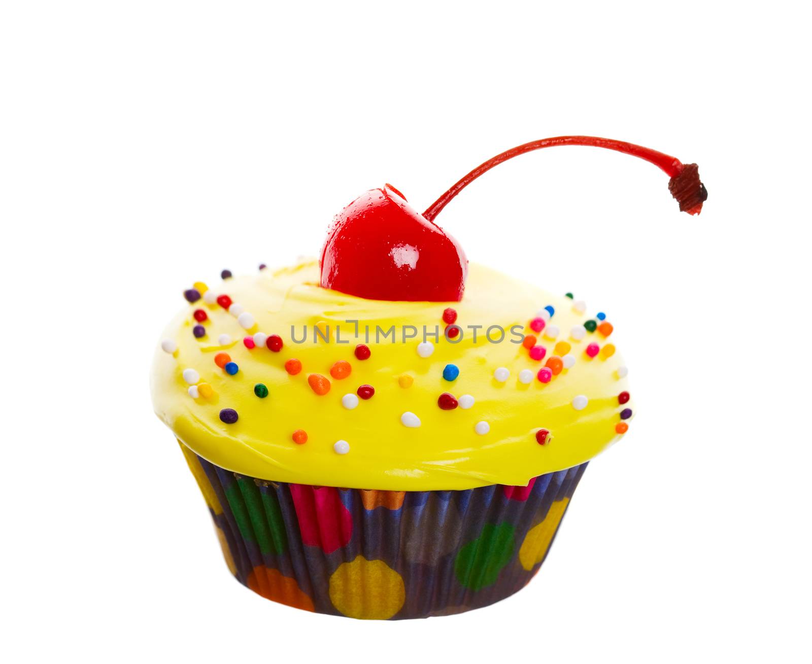 Delectable yellow cupcake topped with a cherry and multi-colored sprinkles.  Shot on white background.  Wide angle view.