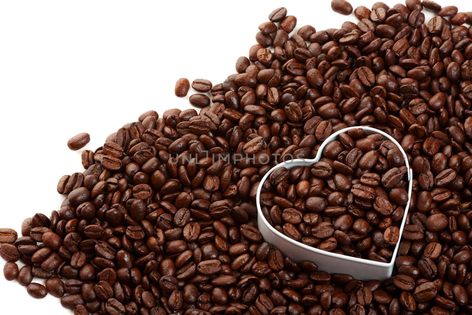 Coffee beans with a heart shape; metaphor for the coffee lovers.