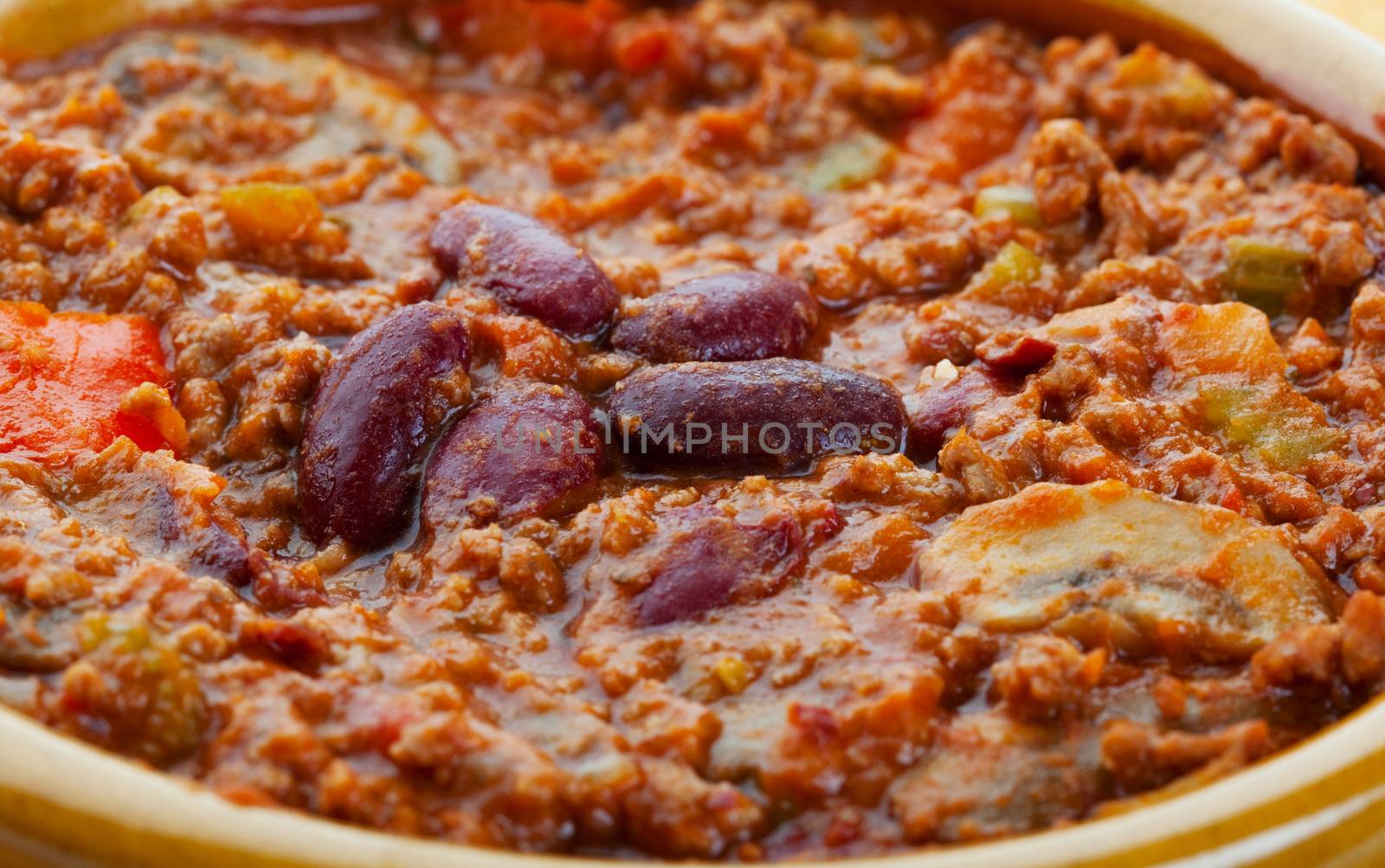 A closeup of chili con carne in a bowl.