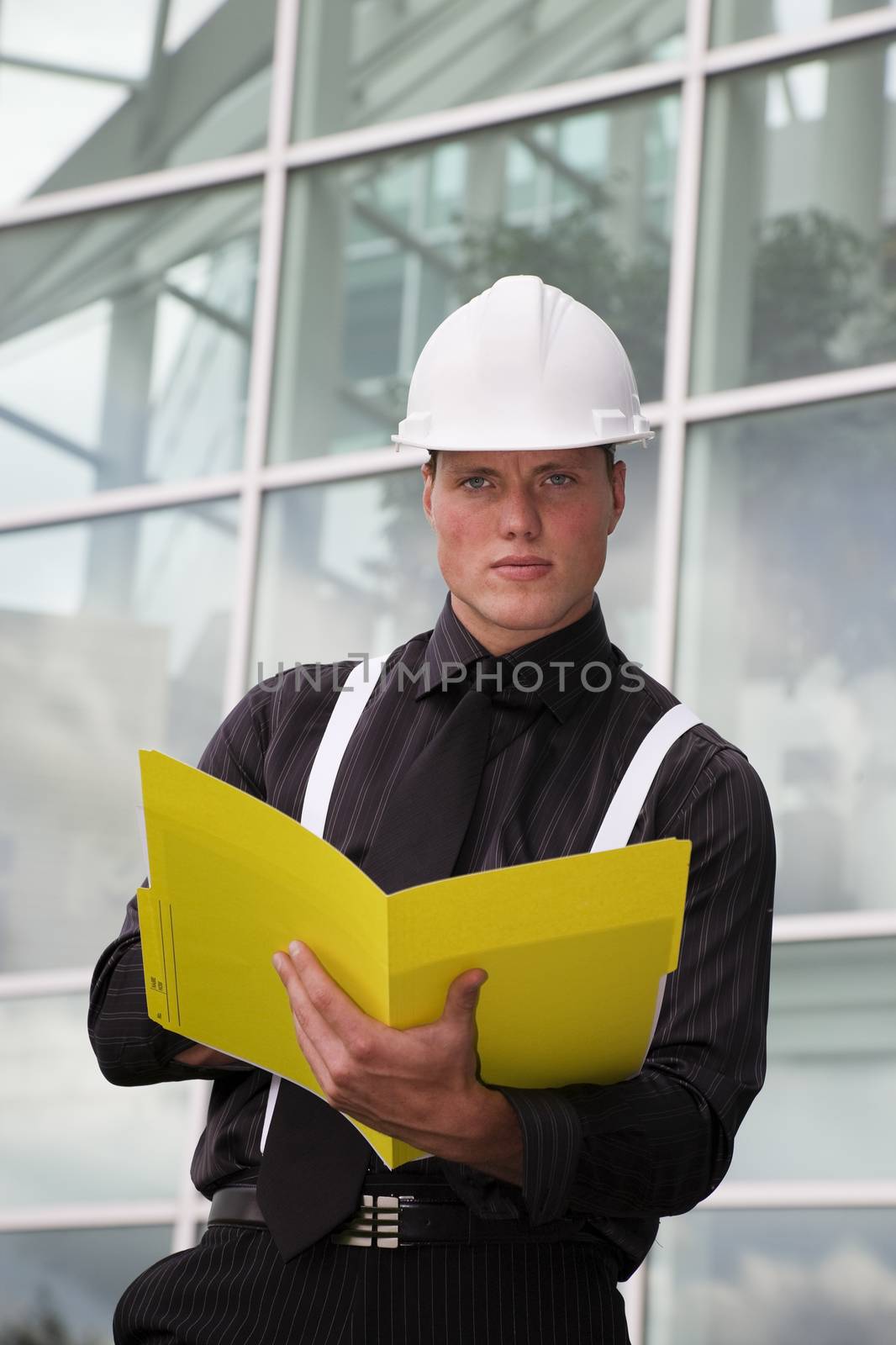 A young engineer going over his notes.