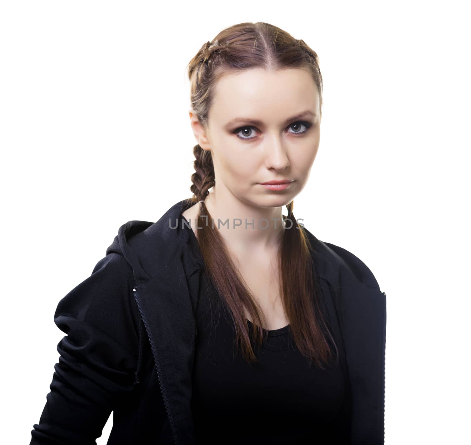 Portrait of a serious young beautiful woman on a white background