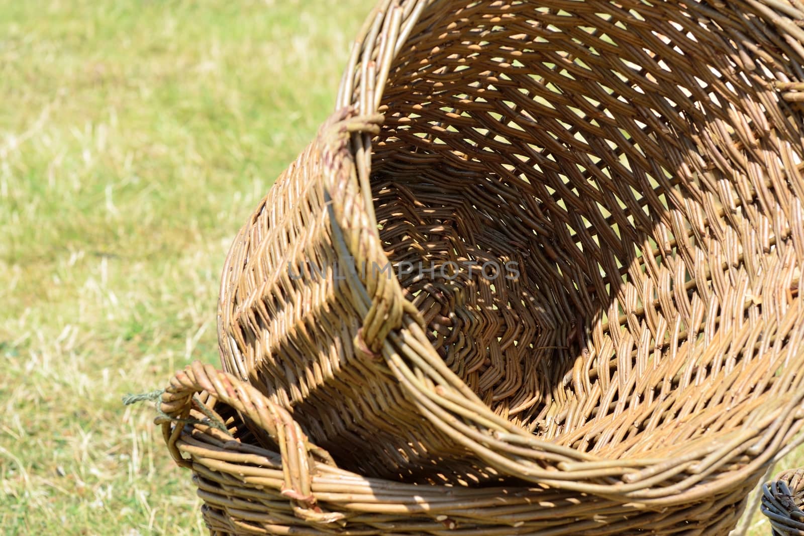 Empty wicker baskets in field