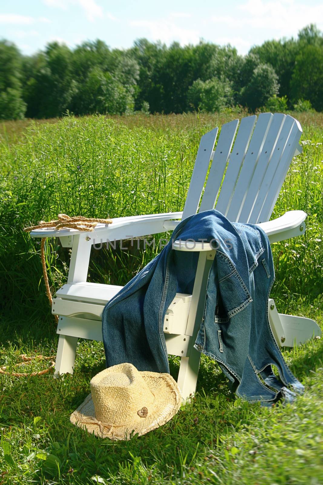 Jeans laying on chair  by Sandralise