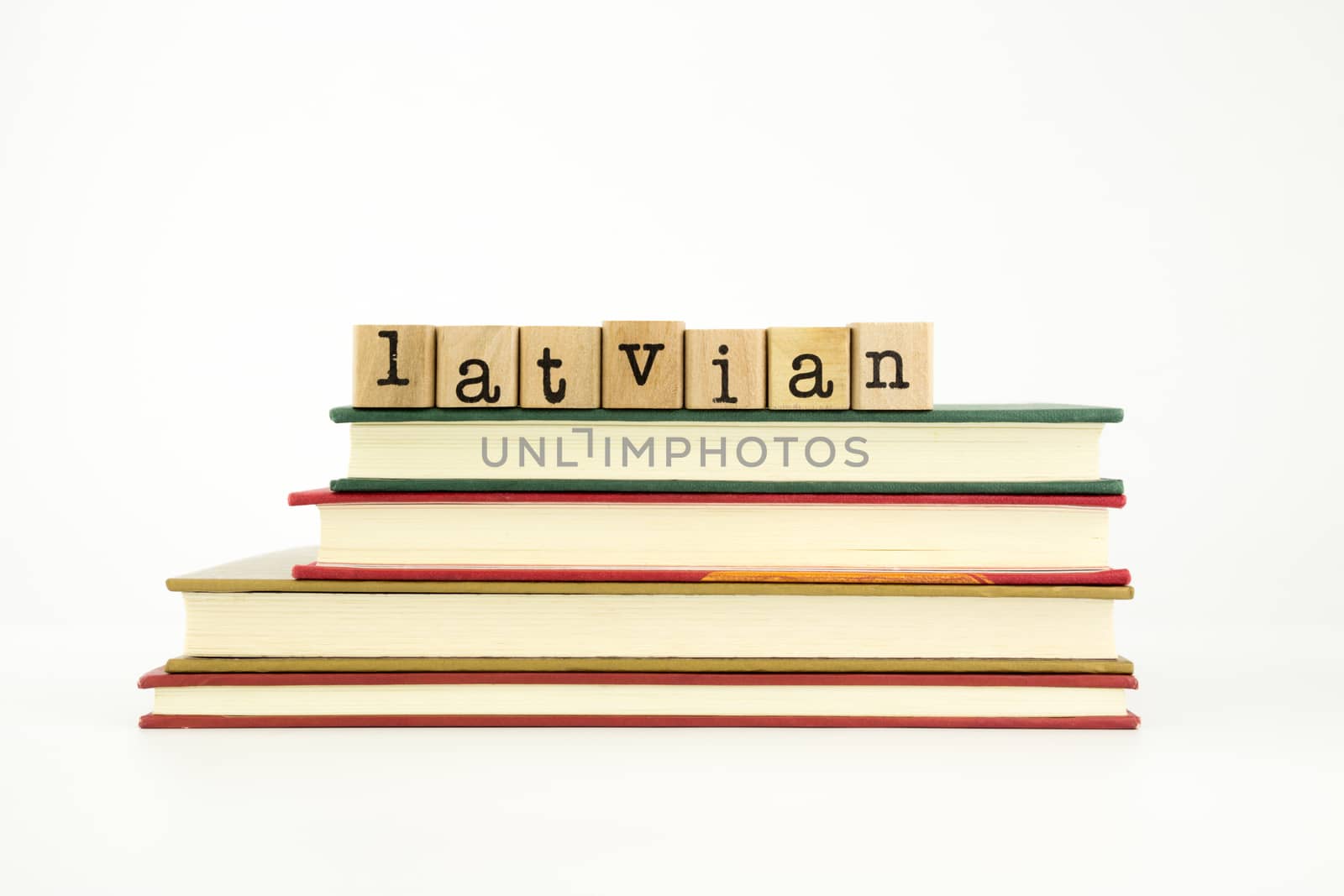 latvian language word on wood stamps and books by vinnstock