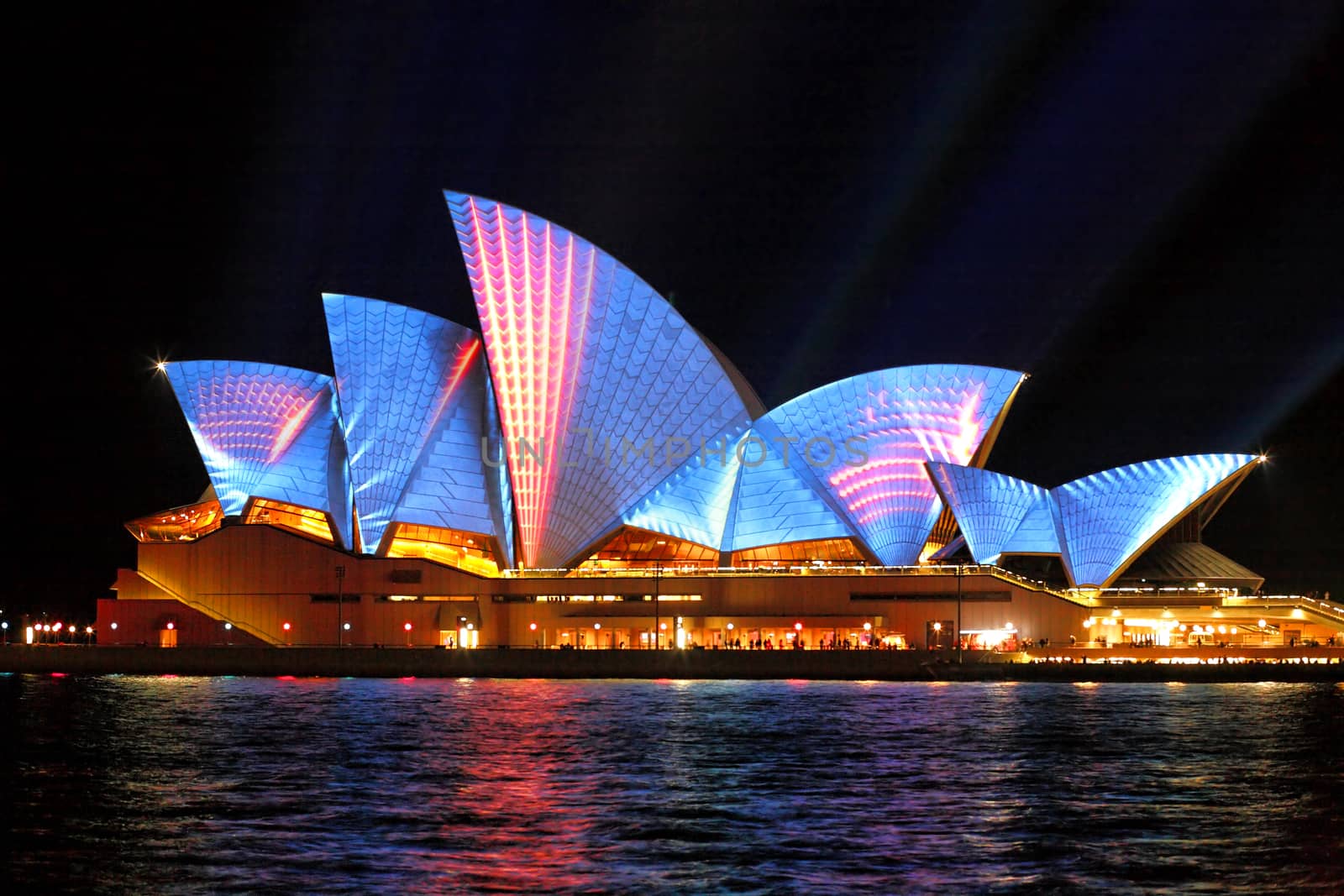SYDNEY, AUSTRALIA - JUNE 2, 2014;  Vivid Sydney Festival, beautiful bright blue with red moving strips of light projected onto the  Sydney Opera House  during Vivid  annual festival of light, music and ideas