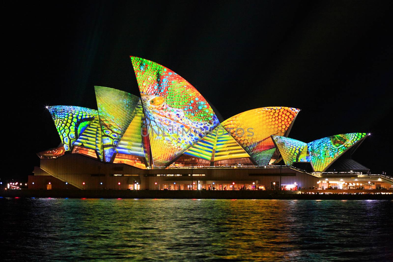 SYDNEY, AUSTRALIA - JUNE 2, 2014;  Vivid Sydney Festival, the Sydney Opera House in summery colours of lime, aqua, yellow and orange intricate patterns for Vivid  annual festival of light, music and ideas