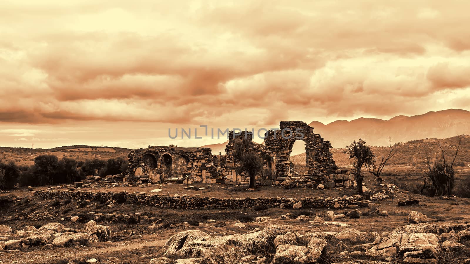 Pillar ruins at Ancient Troizina at dramatic sky, Peloponnese, Greece