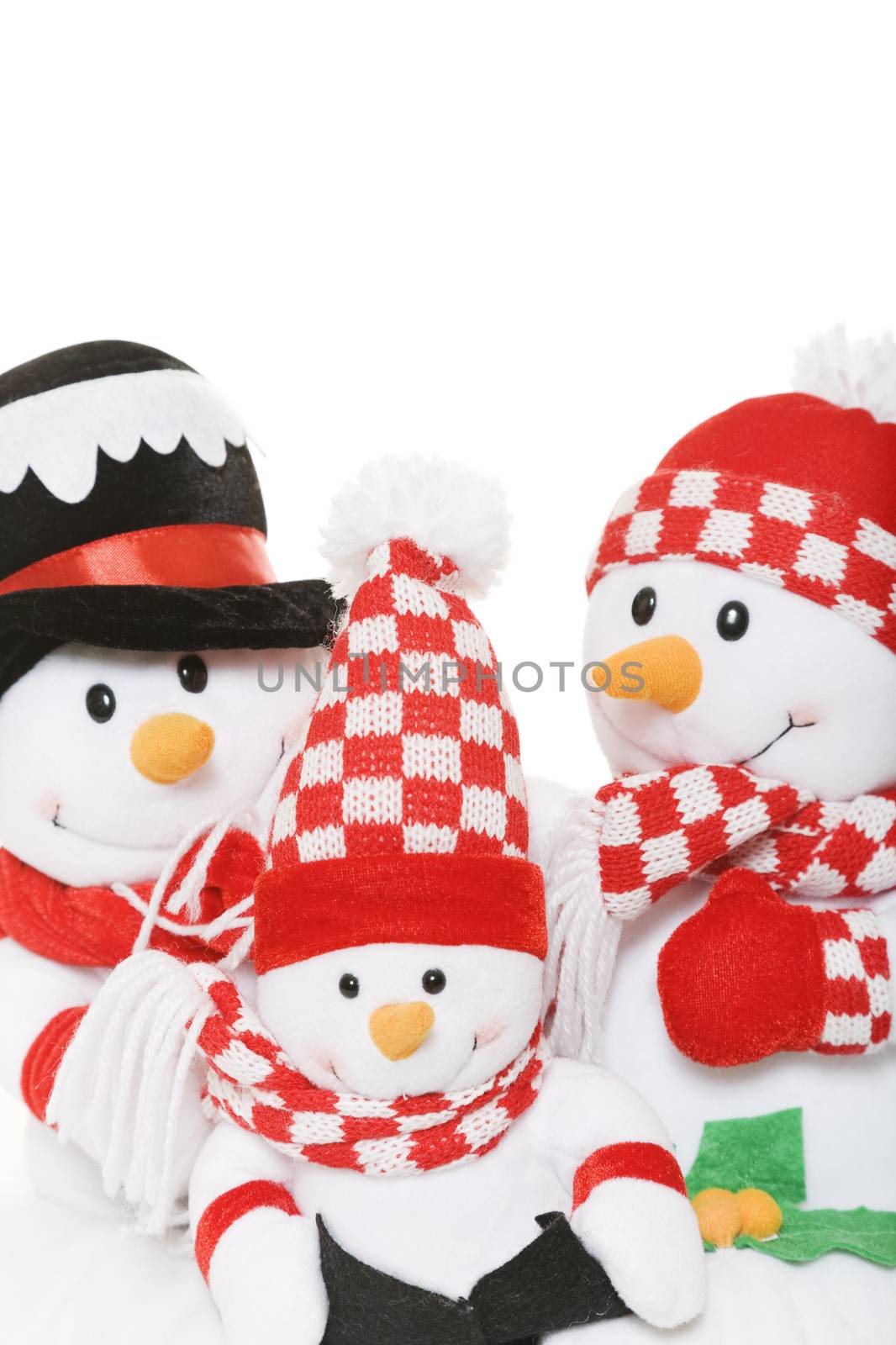 A snowman family dressed in winter attire.