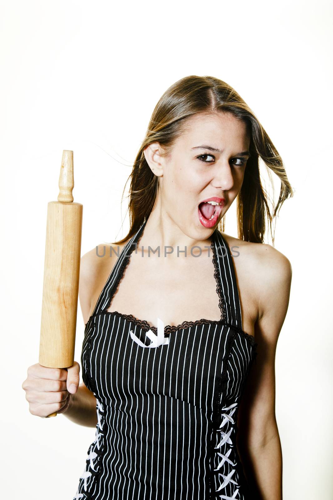 A sterotypical image of  a ticked off young wife with rolling pin.