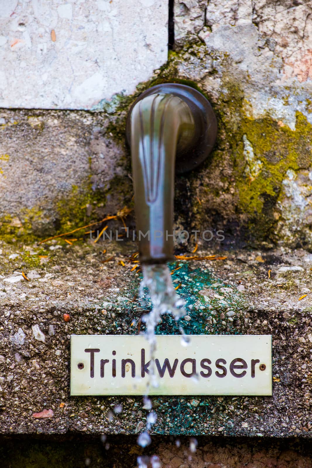 Old style faucet on the street in Austria