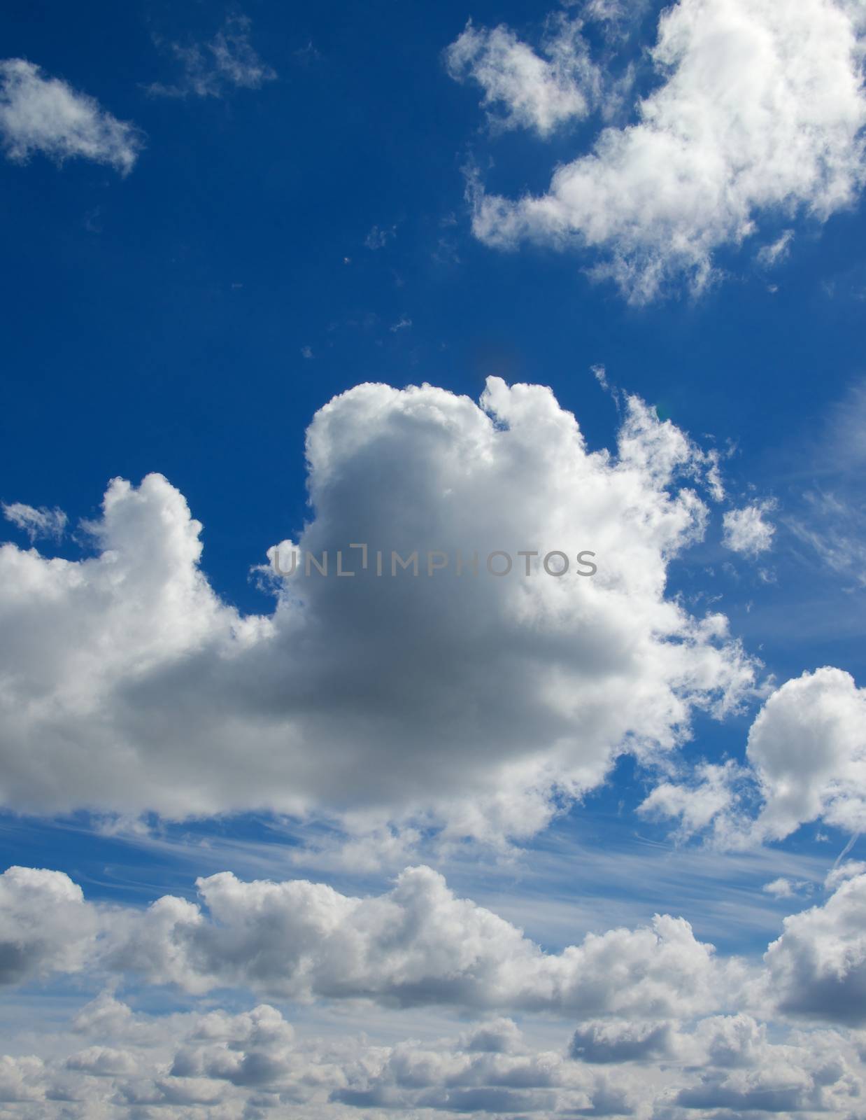 Fluffy White Clouds on Blue Sunny Sky Outdoors