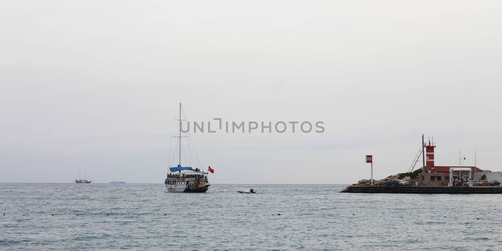 Sail ship moving away from the shore