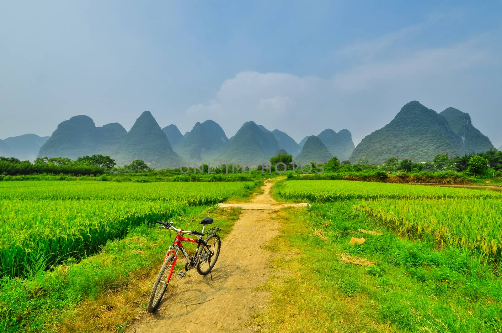 biking on Li river mountain landscape in Yangshuo Guilin by weltreisendertj