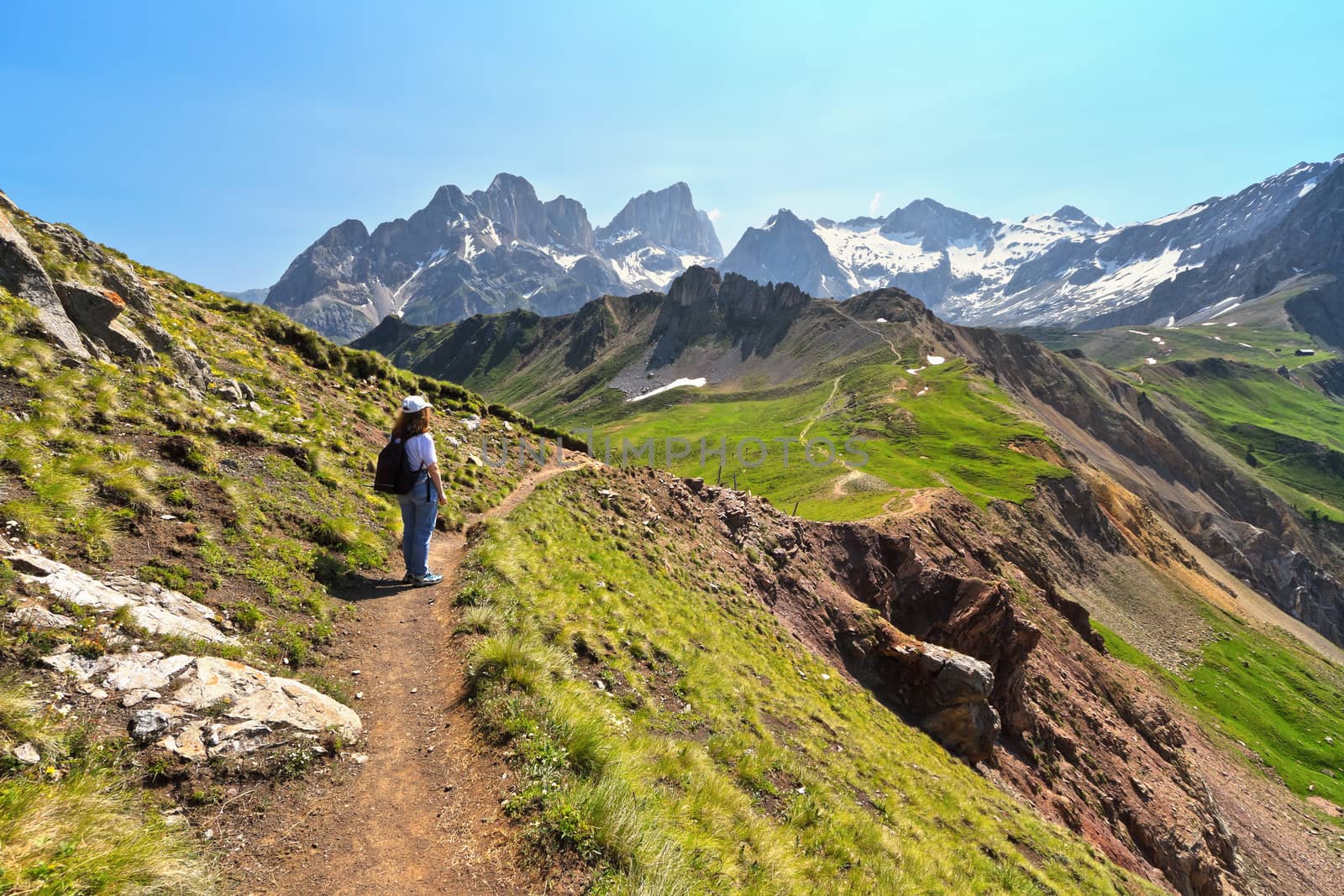 woman is watching panoramo from a scenic spot in Val di Fassa, Trentino, Italy. On background mount Marmolada