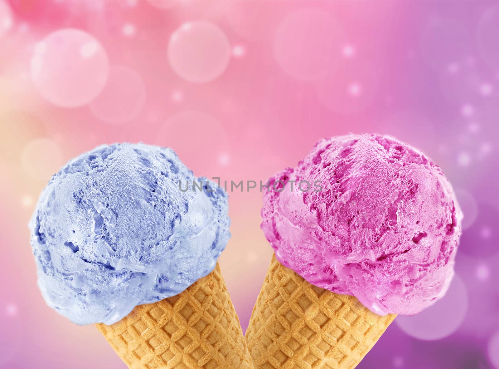 Blue and Pinkberry Ice cream in the cone with abstract light background.