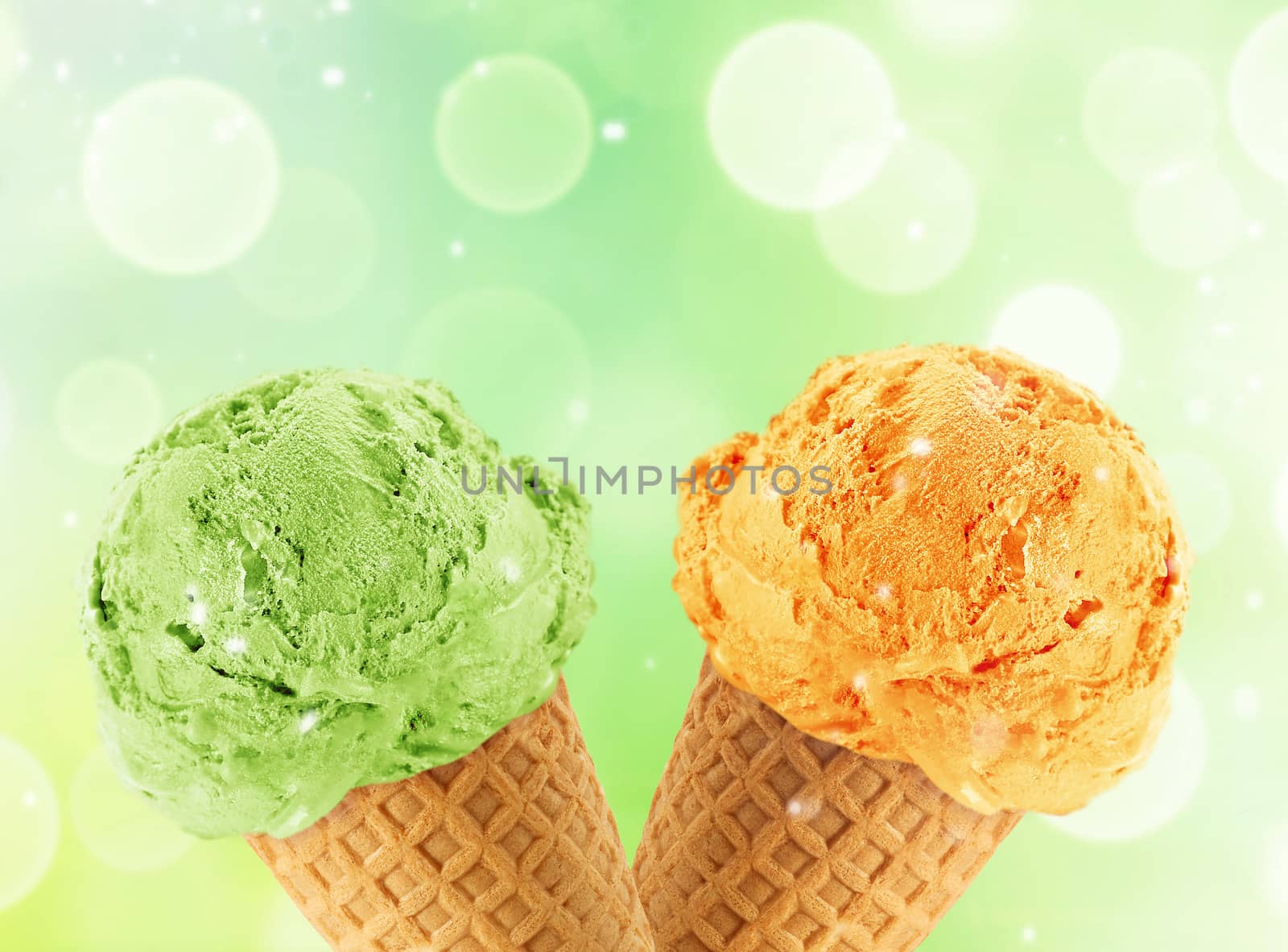 Kiwi and mango Ice cream in the cone with abstract light background.