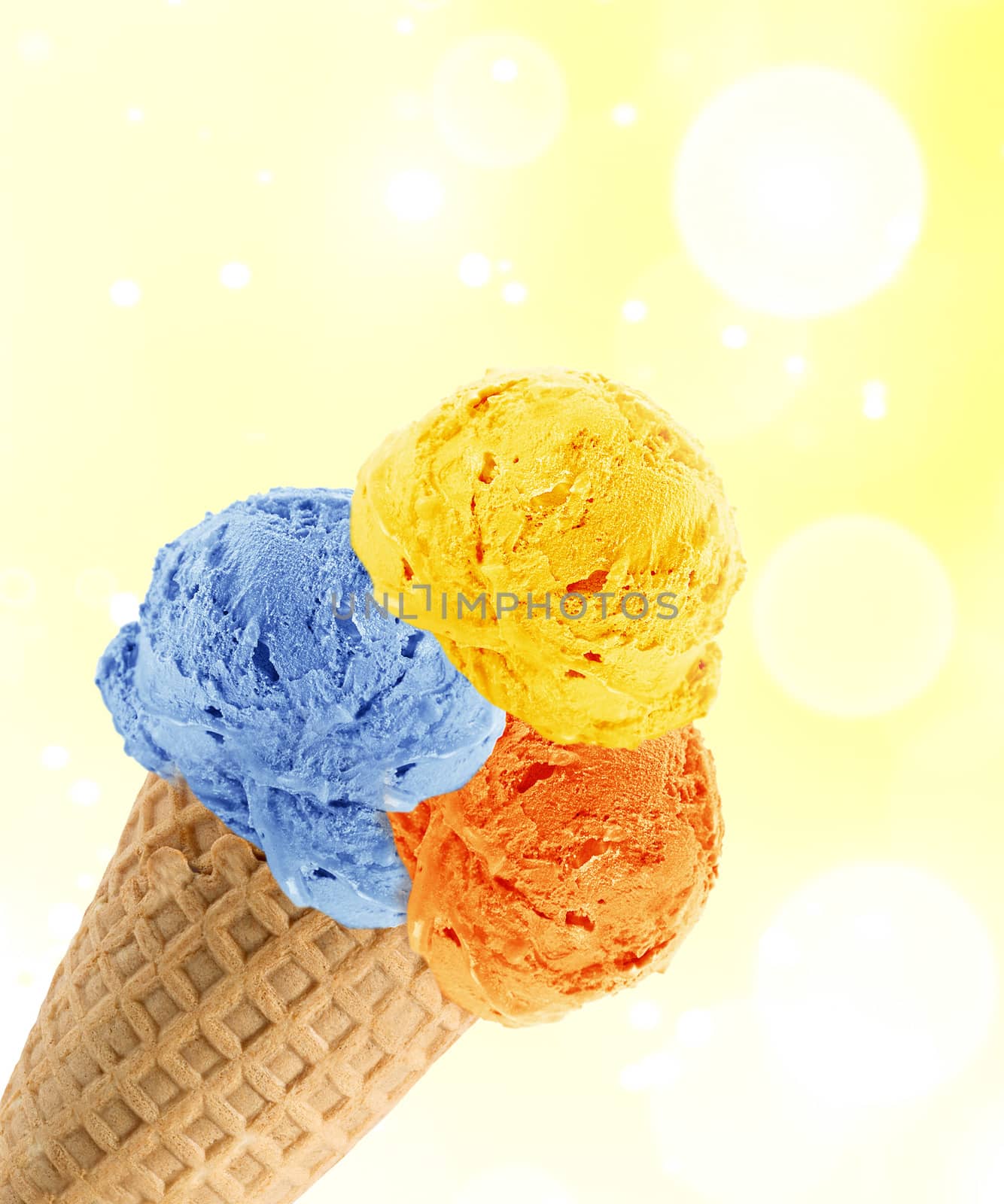 three Ice cream scoops in the cone with abstract light background.