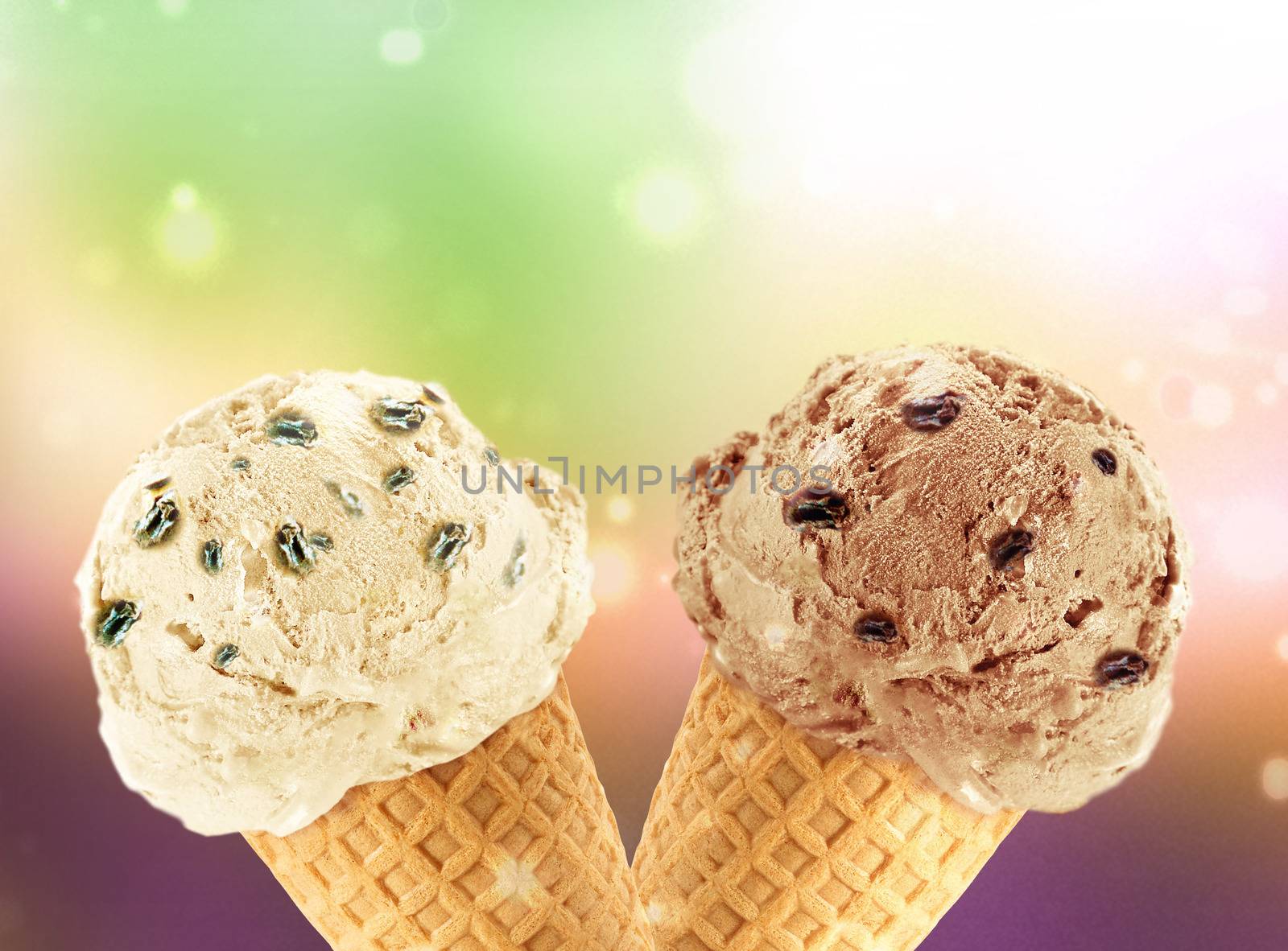 Vanilla and chocolate Ice cream in the cone with abstract light background.