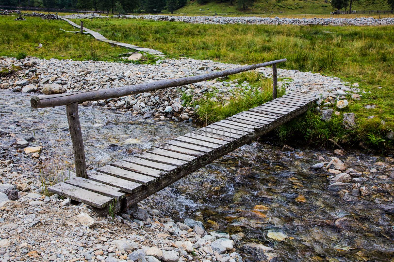 Wooden bridge in high Alps mountains Austria