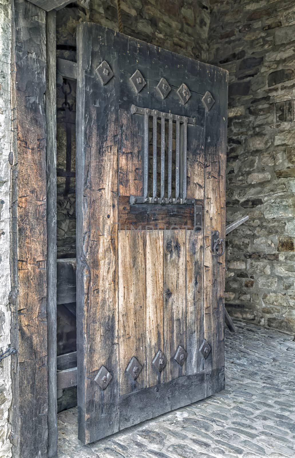 Wooden Door with Iron Bars by fallesenphotography