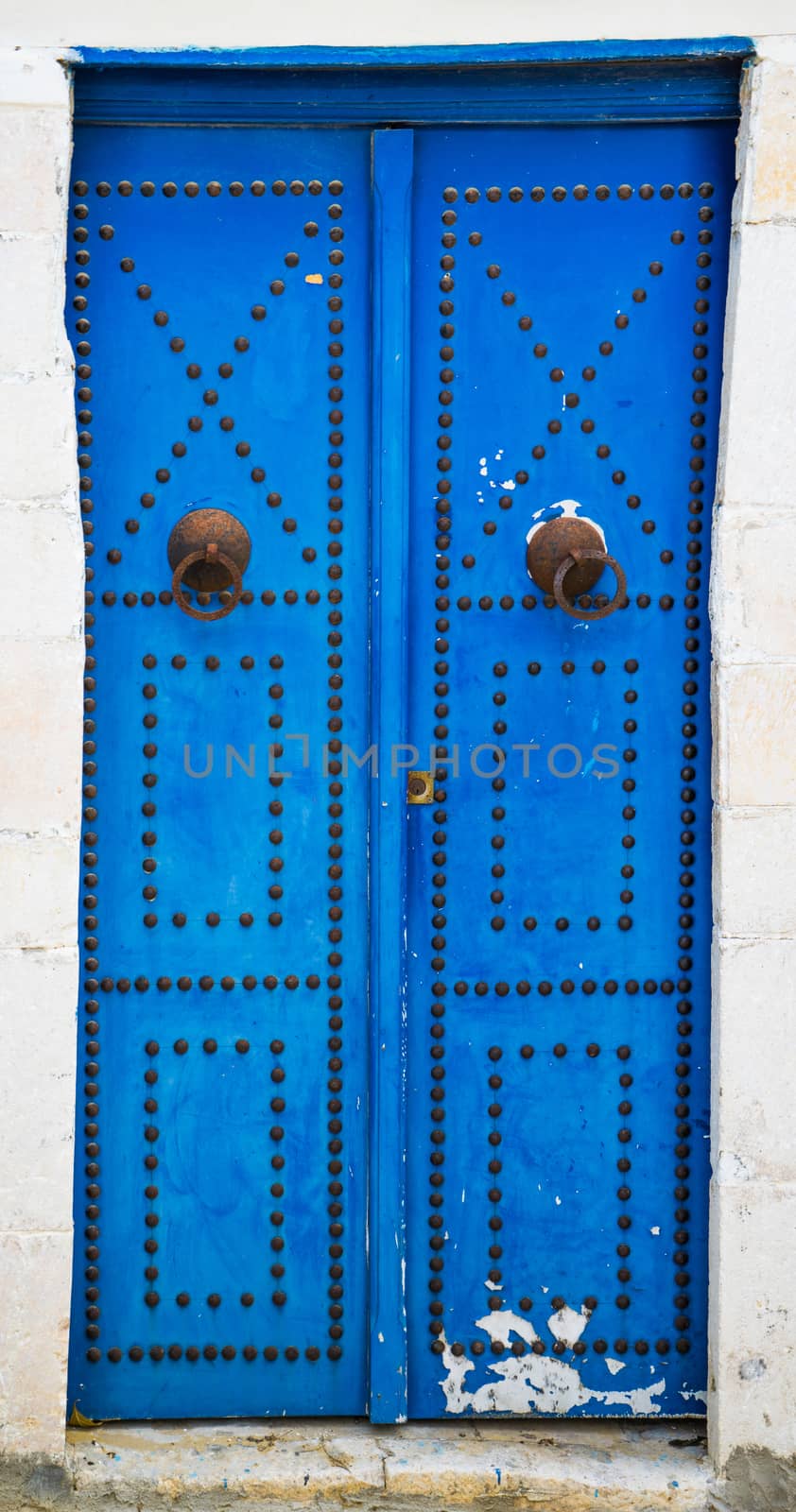 Blue aged door with ornament from Sidi Bou Said in Tunisia. Large resolution