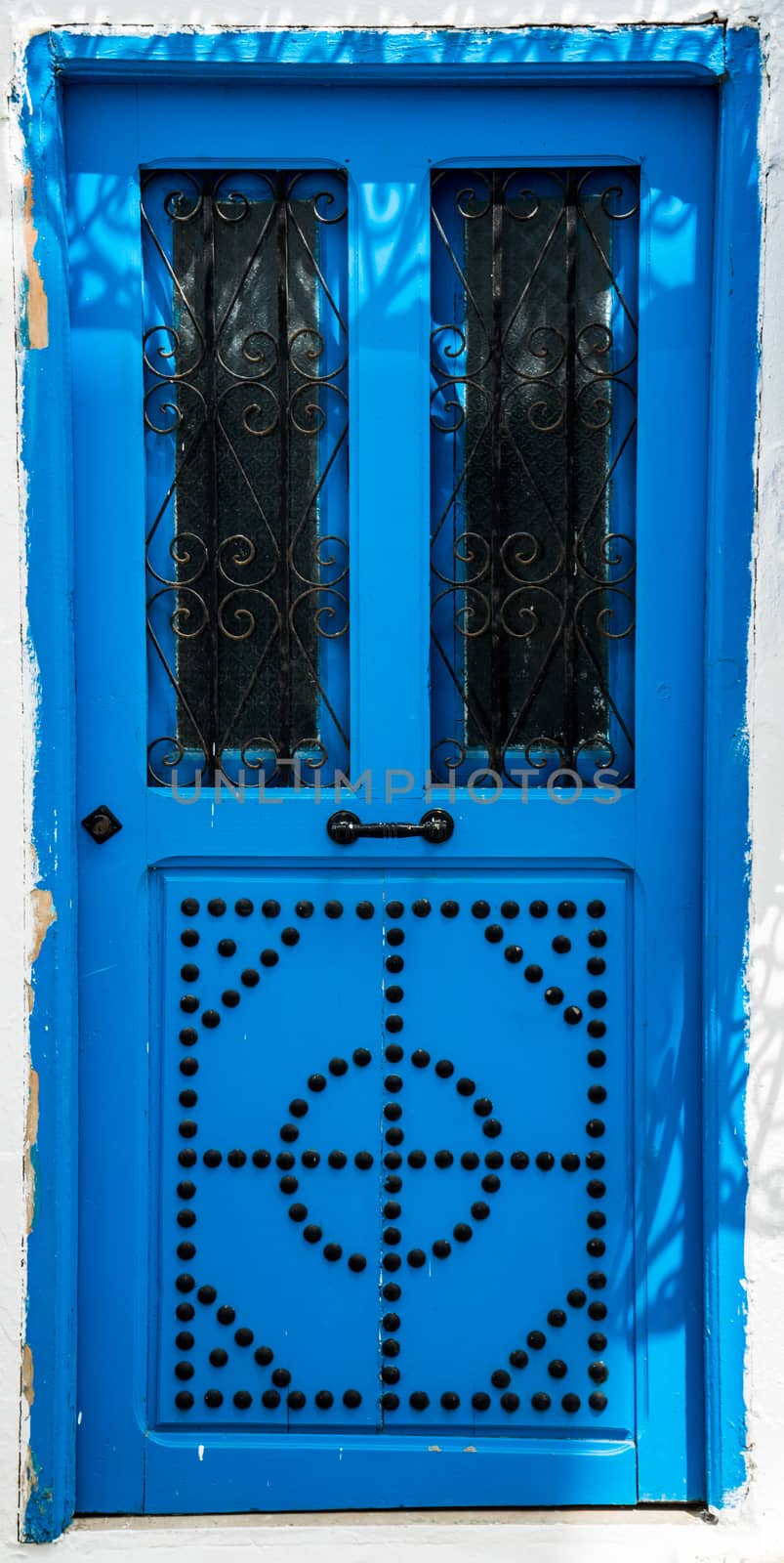 Blue door with ornament as symbol of Sidi Bou Said in Tunisia. Large resolution