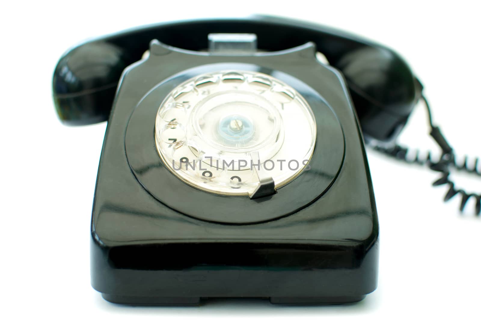 Vintage telephone over a white background