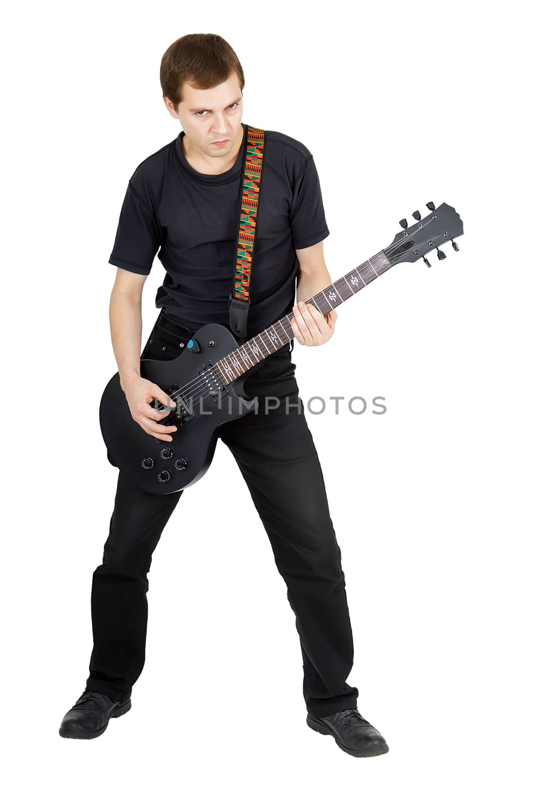 Young man with electric guitar isolated on white background. Performer of rock music