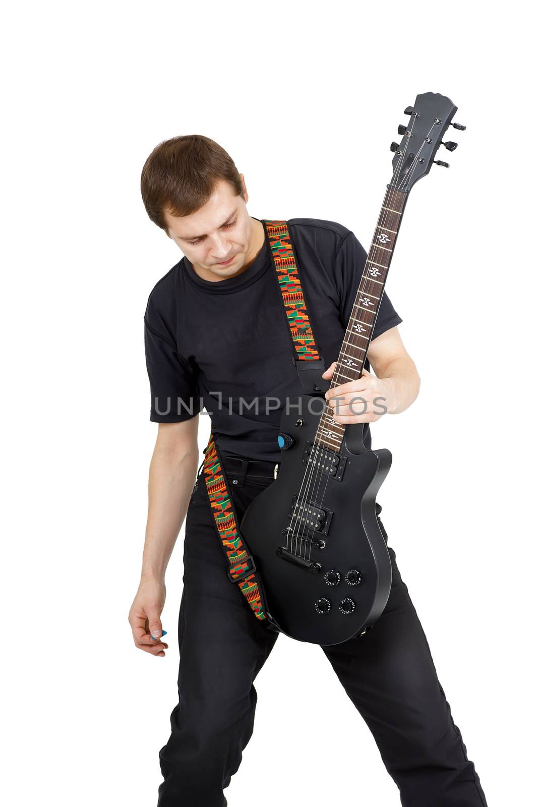 Young man with electric guitar isolated on white background. Performer of rock music